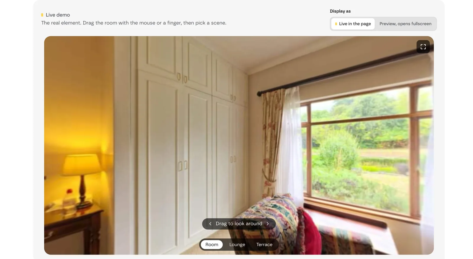 A hotel room shown in 360, with the «Drag to look around» hint and the Room, Lounge and Terrace scene buttons